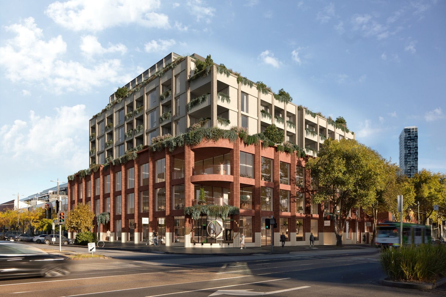 Modern real estate development: mixed-use building with a brick base and terraced upper levels adorned with greenery on a sunny urban corner.